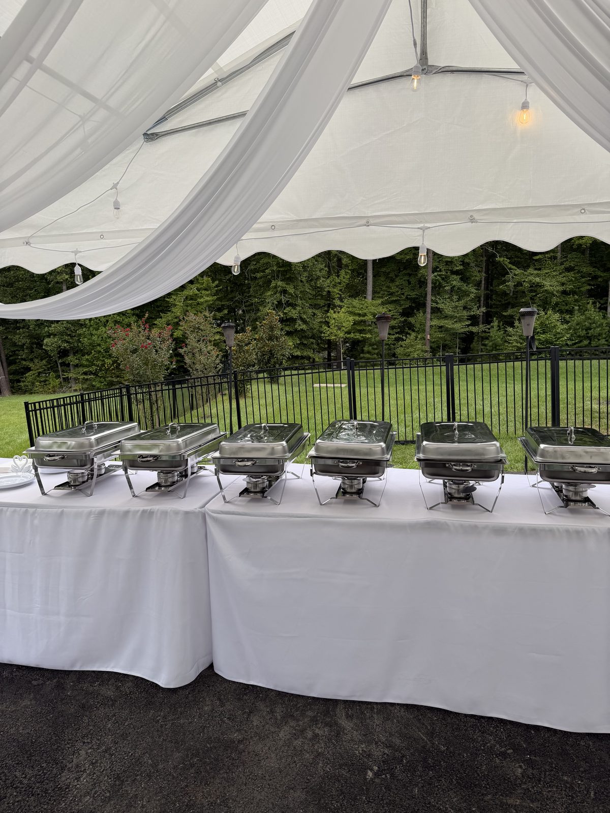 Buffet table with a row of chafing dishes